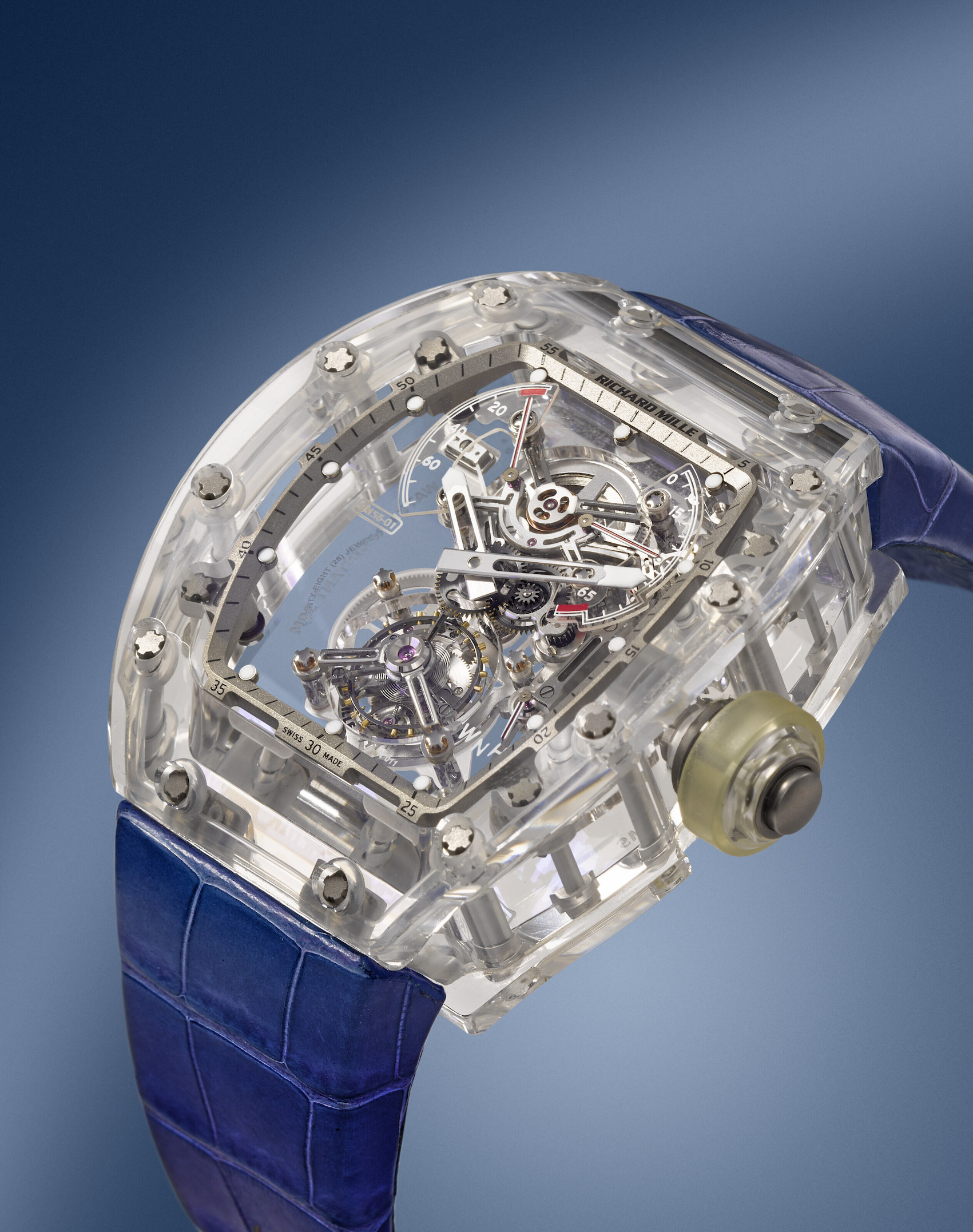 RICHARD MILLE. AN EXTRAORDINARY AND EXTREMELY RARE TRANSPARENT SAPPHIRE CRYSTAL AND TITANIUM LIMITED EDITION SKELETONIZED TOURBILLON WRISTWATCH WITH POWER RESERVE AND TORQUE INDICATOR